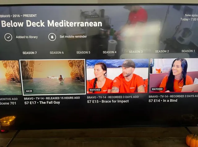 An authorization error notification appears on a television screen regarding Bravo app access.