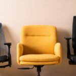 A stylish and comfortable ergonomic desk chair sits in a bright modern home office.