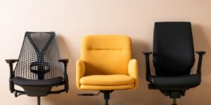 A stylish and comfortable ergonomic desk chair sits in a bright modern home office.