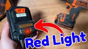 A Black and Decker battery charger sits on a workbench while not working.
