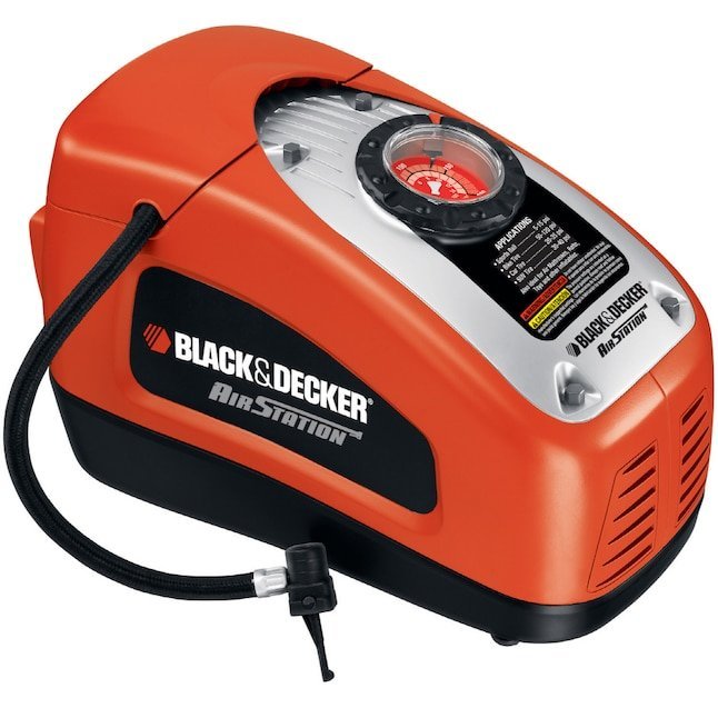 A person inspects the battery indicator and intake vent of an air pump.