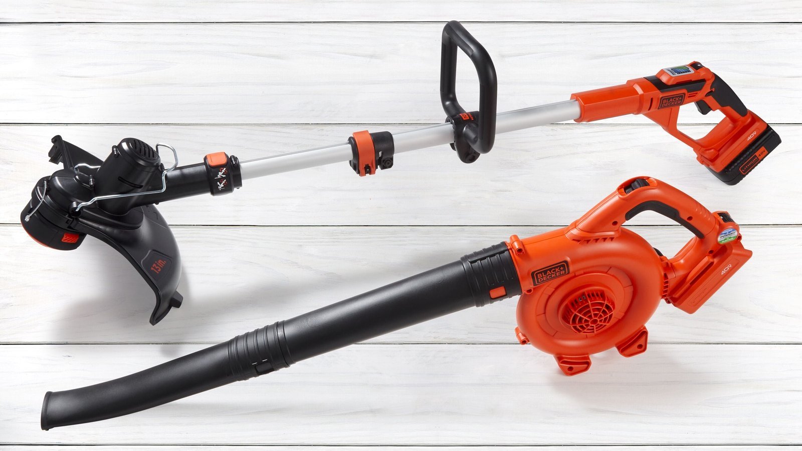 A leaf blower and maintenance tools arranged neatly on a workshop bench.