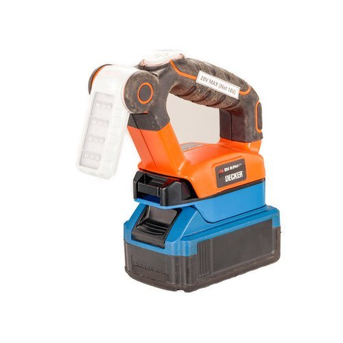 Using a screwdriver to inspect the carbon brushes of a sander.