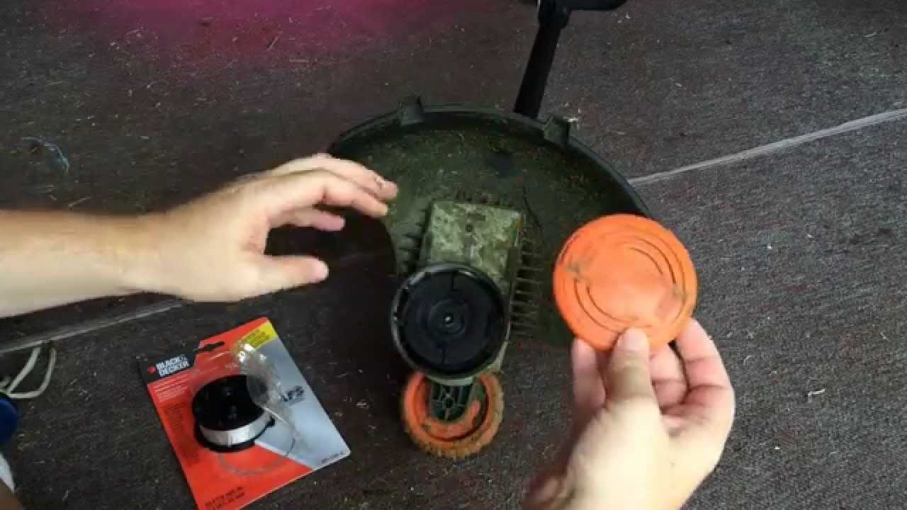 Tools and replacement parts for repairing a Black and Decker trimmer.