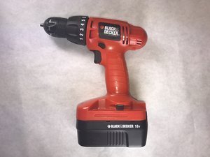 The internal trigger mechanism inside the handle of a cordless drill.
