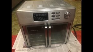 A clean modern air fryer sits on a kitchen counter ready for troubleshooting.