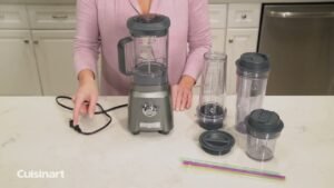 A disassembled blender sits on a modern kitchen counter for troubleshooting repairs.