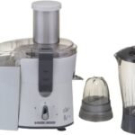 A disassembled electric juicer on a clean kitchen counter awaiting troubleshooting and repair.