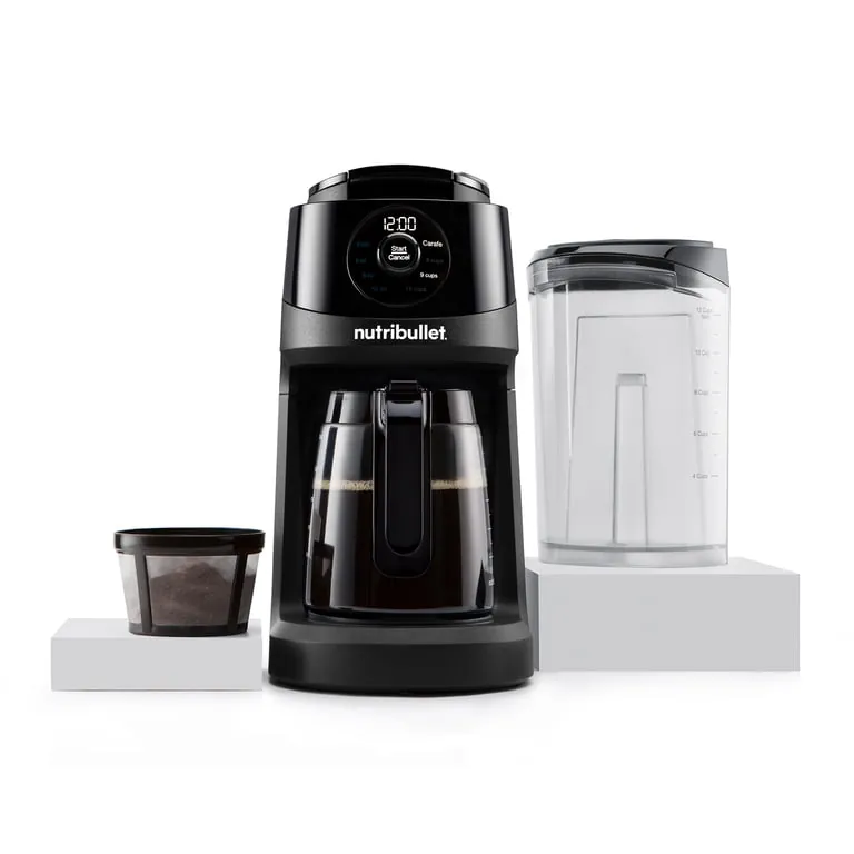 Filtered water and cleaning tools arranged near a coffee maker for routine maintenance.