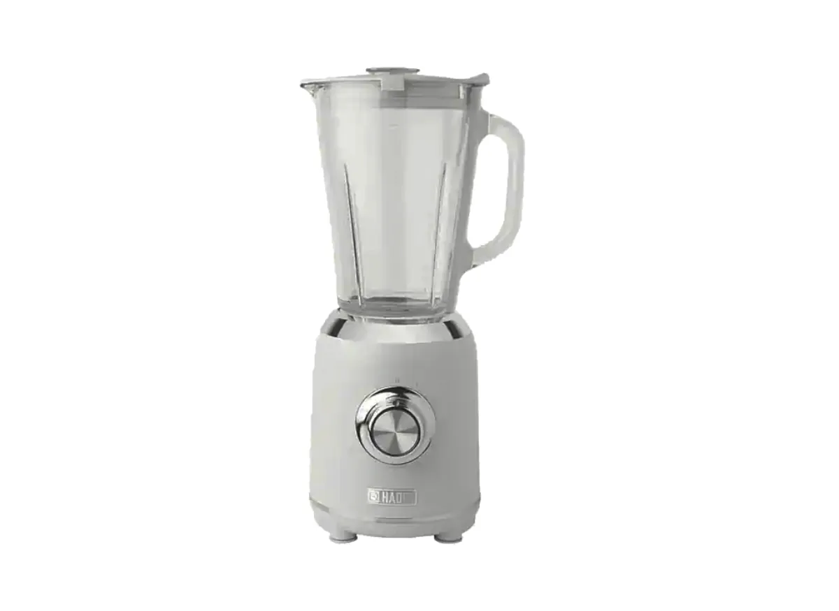 Hands carefully aligning the jar tabs on a Haden blender for safety engagement.