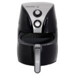 A modern black air fryer sitting on a clean kitchen countertop.