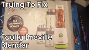 A modern Breville blender sitting on a clean kitchen counter in natural light.