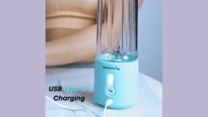 A modern portable blender on a clean kitchen counter showing sleek design details.