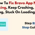A person holding a smartphone showing a frozen screen while troubleshooting Bravo app.