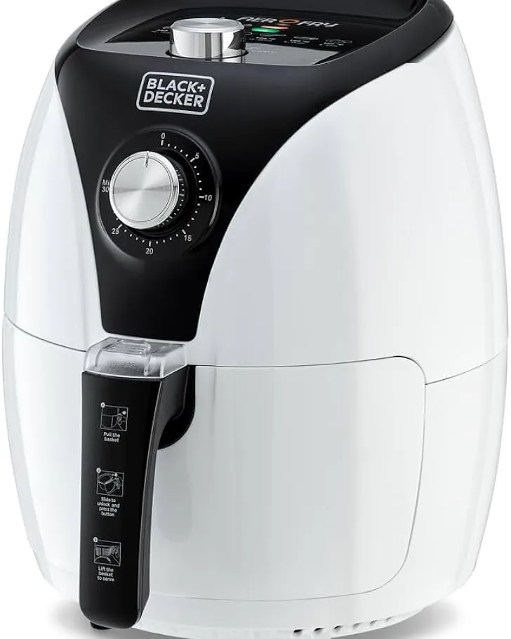 A person preparing to troubleshoot a malfunctioning air fryer in a kitchen.