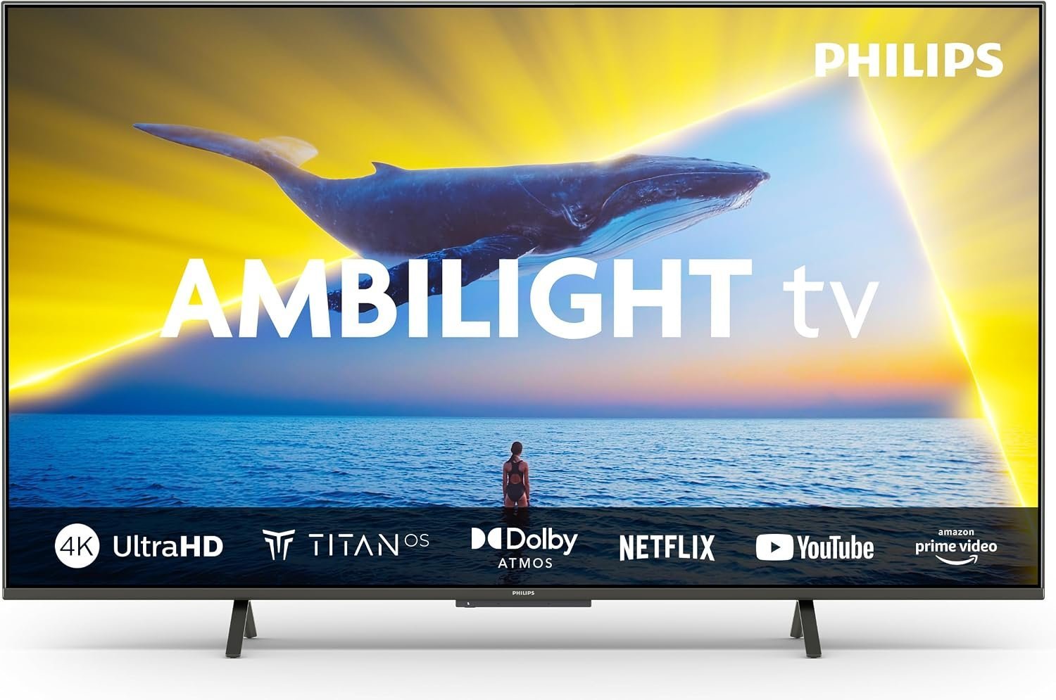 Hands holding a remote pointing at a Philips Android TV screen with a loading error.