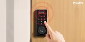 A modern smart door lock installed on a sleek wooden front door.