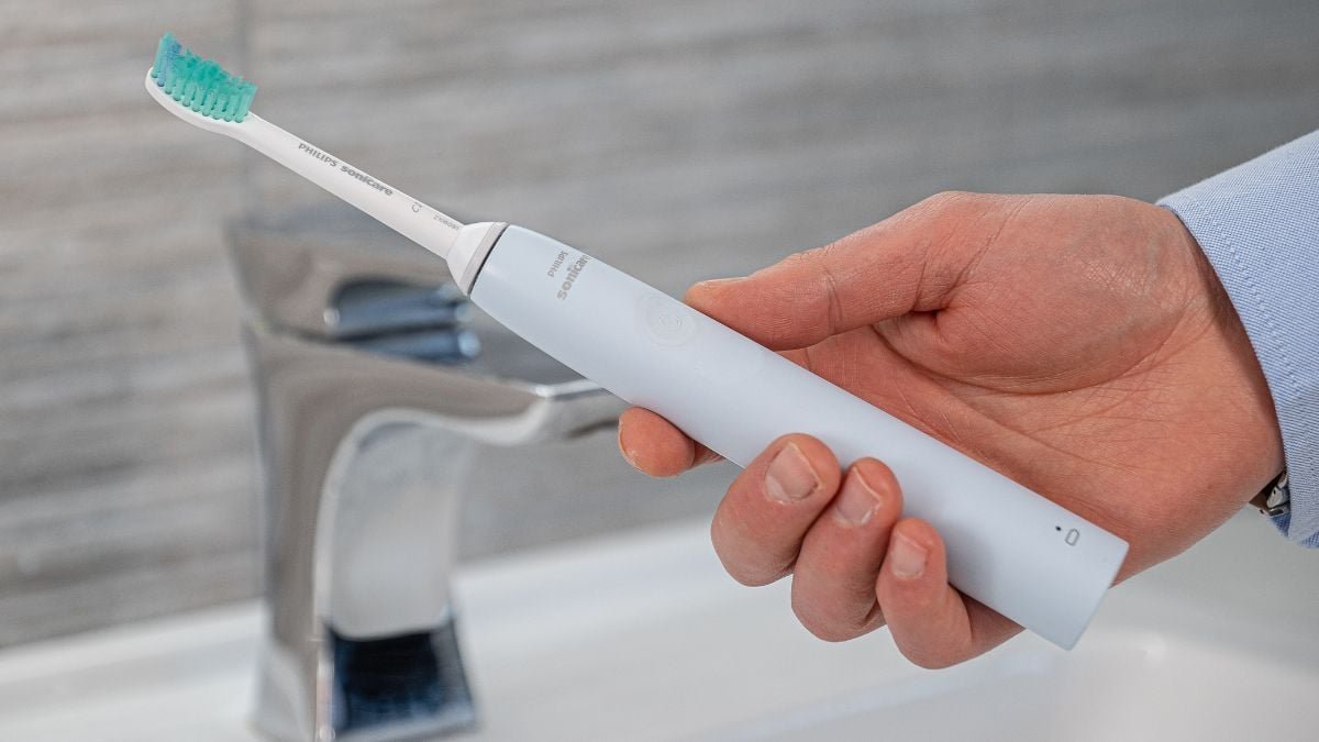 Tilting a Philips iron to remove trapped air from the water system.