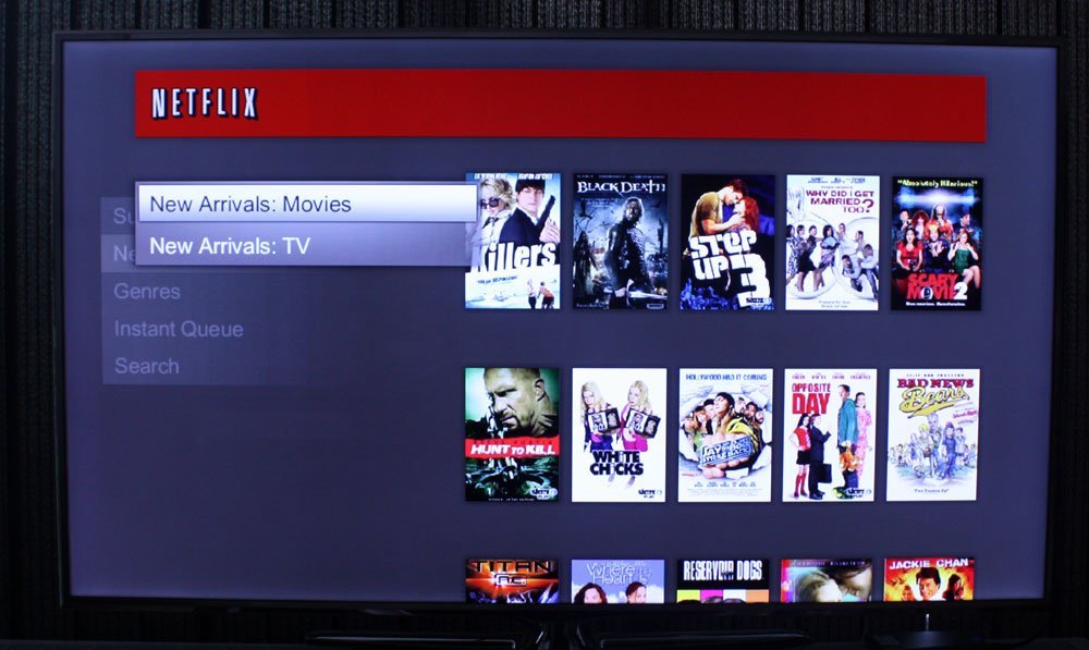 A minimalist home entertainment setup featuring a Philips television and wireless router.