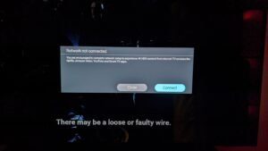 A modern Philips television displaying a network error icon in a bright living room.