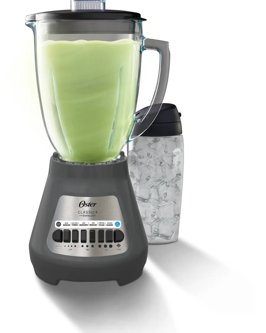 A portable blender displaying a red LED error light during a troubleshooting session.