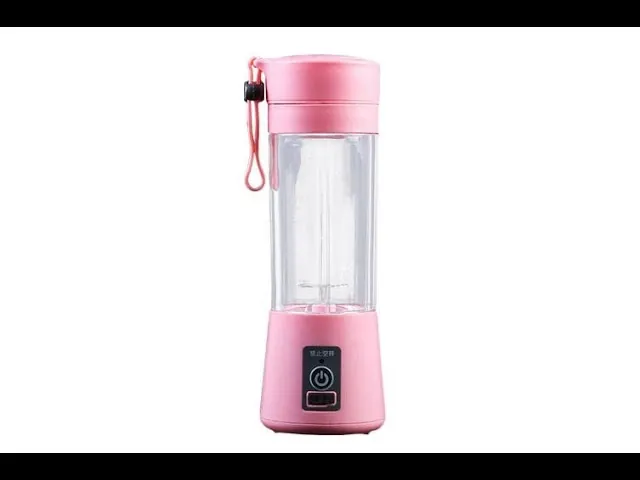 A portable blender jar filled with the correct ratio of fruit and liquid.