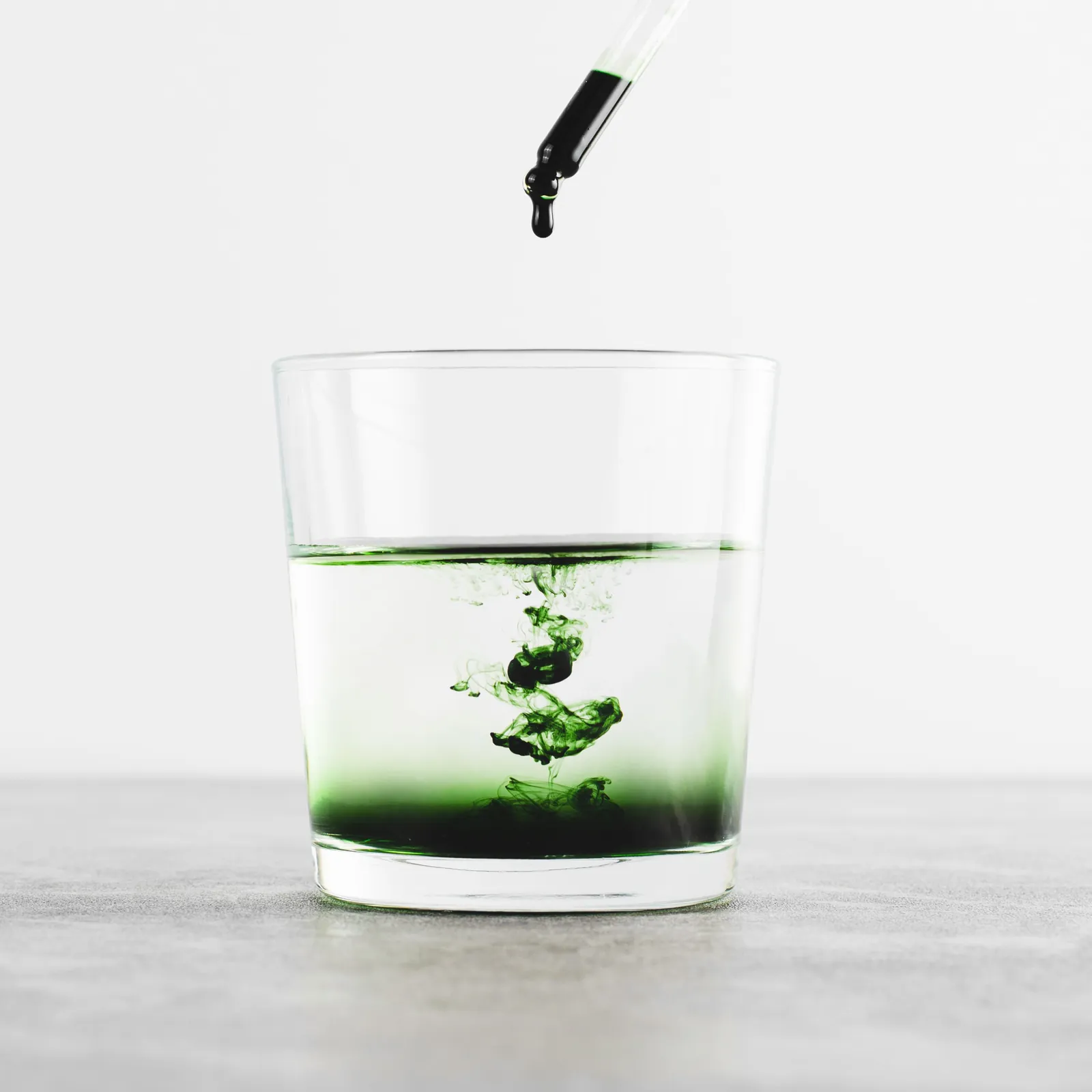 Professional skincare products including salicylic acid cleanser sit on a clean bathroom counter.
