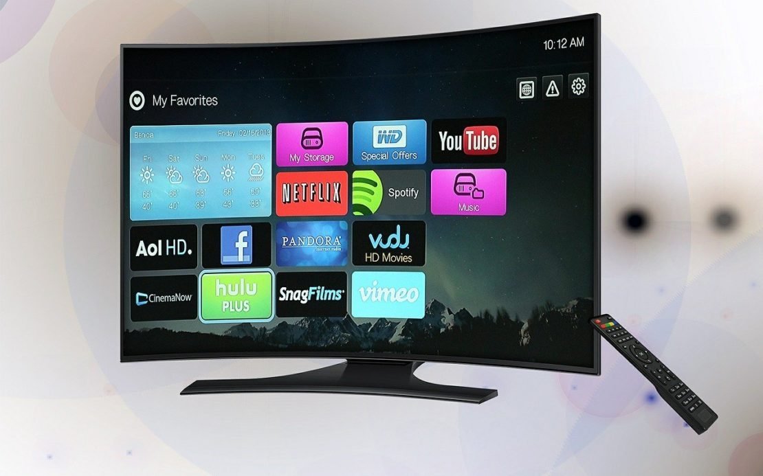 A user prepares to connect a streaming stick to their television for better Netflix access.