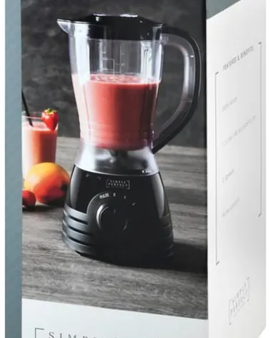 Wiping down a blender base with a damp cloth for proper safety and maintenance.
