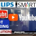 A Philips smart TV showing a frozen YouTube screen in a living room.